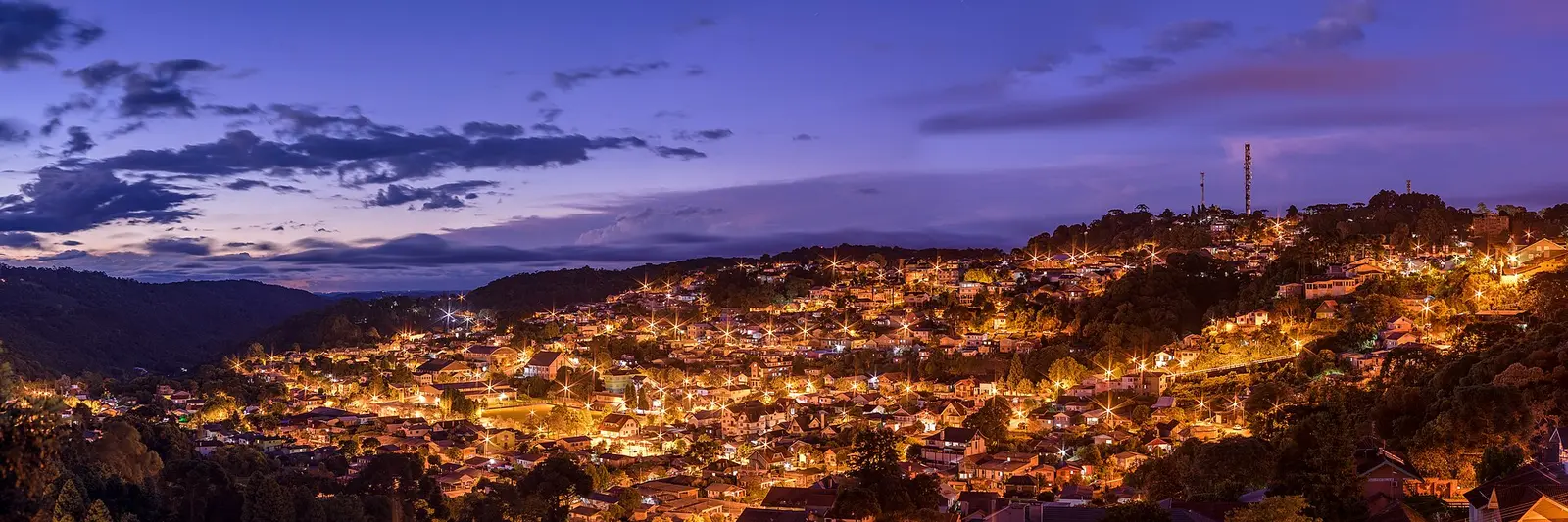 Night panorama of the lit hillside town centre of Gramado