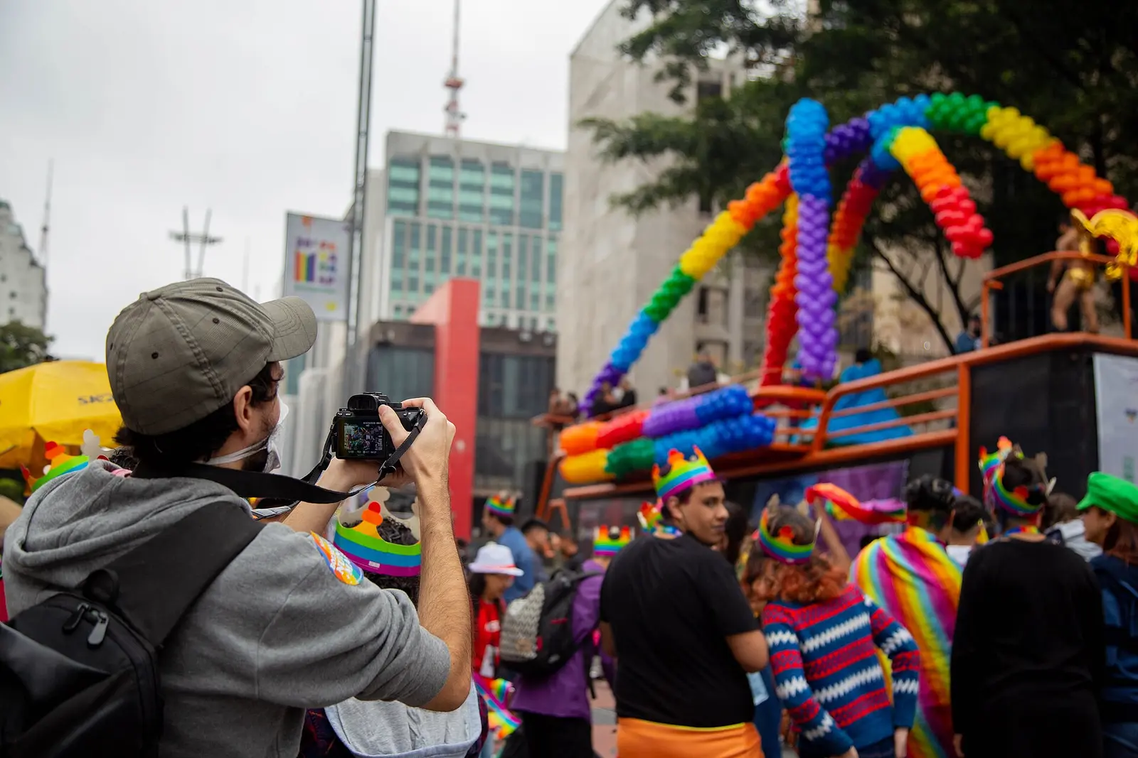 Rainbow float and crowd on Avenida Paulista during the 2022 São Paulo Pride Parade